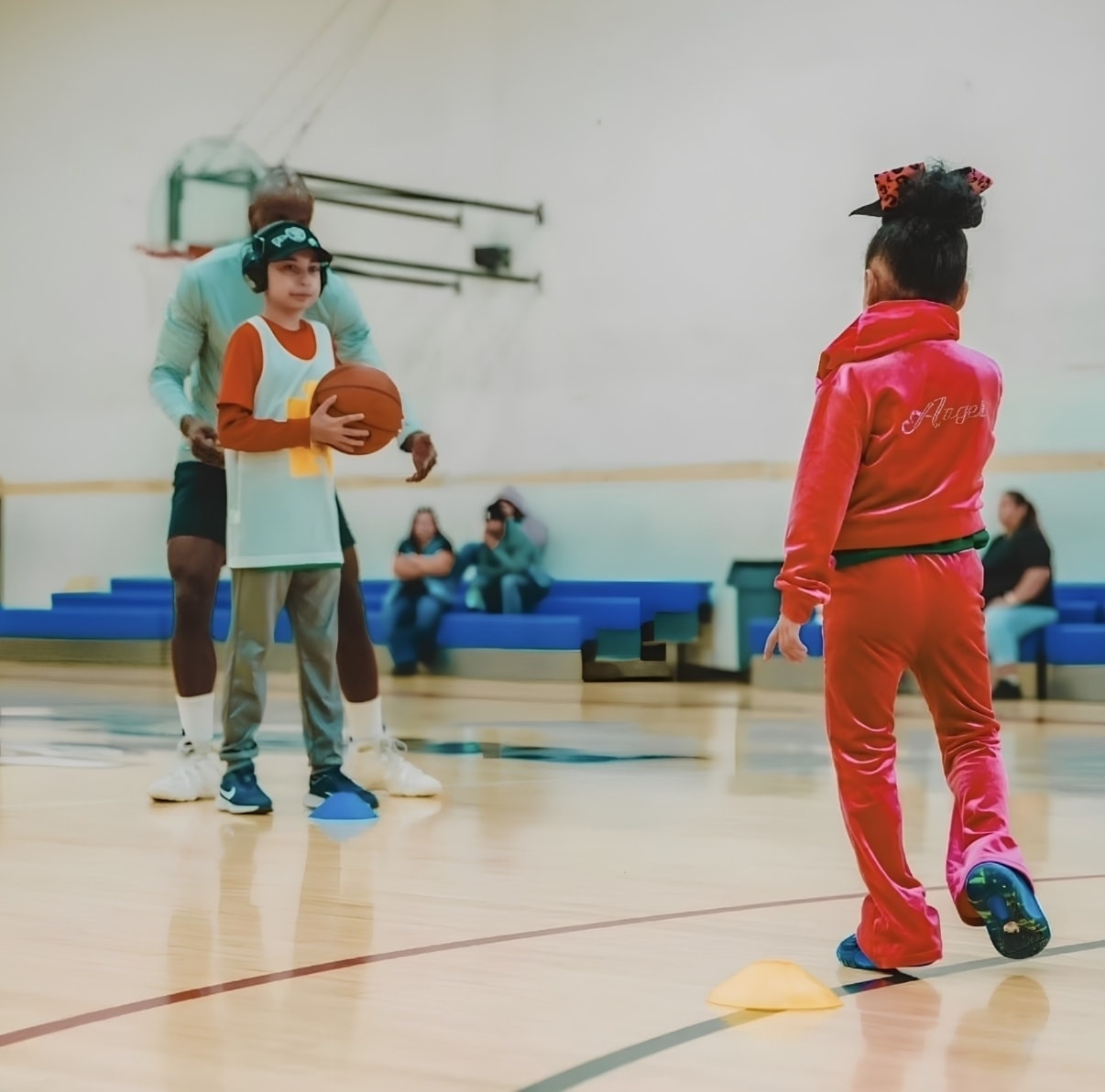 Youth shooting basketball during UDID Academy session