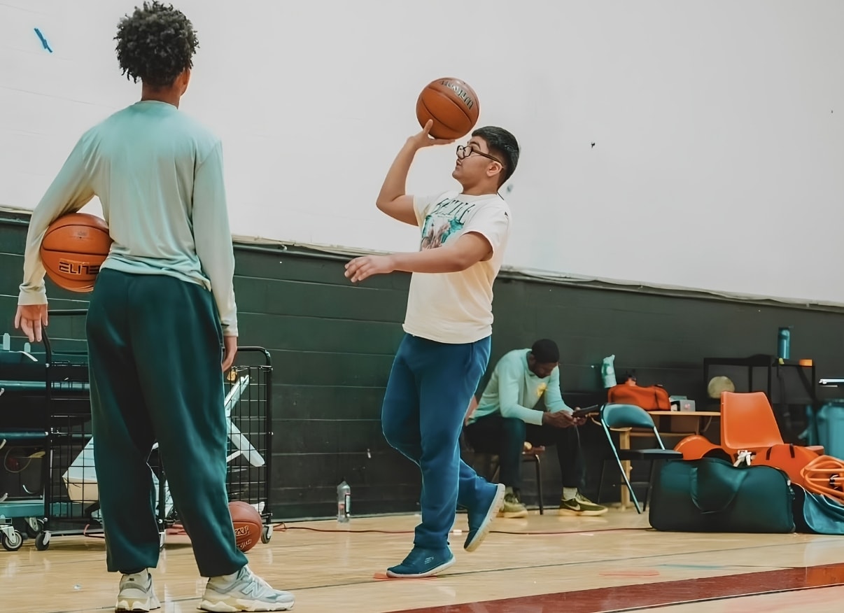 Youth players practicing basketball at UDID Academy
